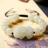 Beaded nephrite jade bracelet with Pixiu charm, a masculine energy accessory for wealth manifestation and good fortune
