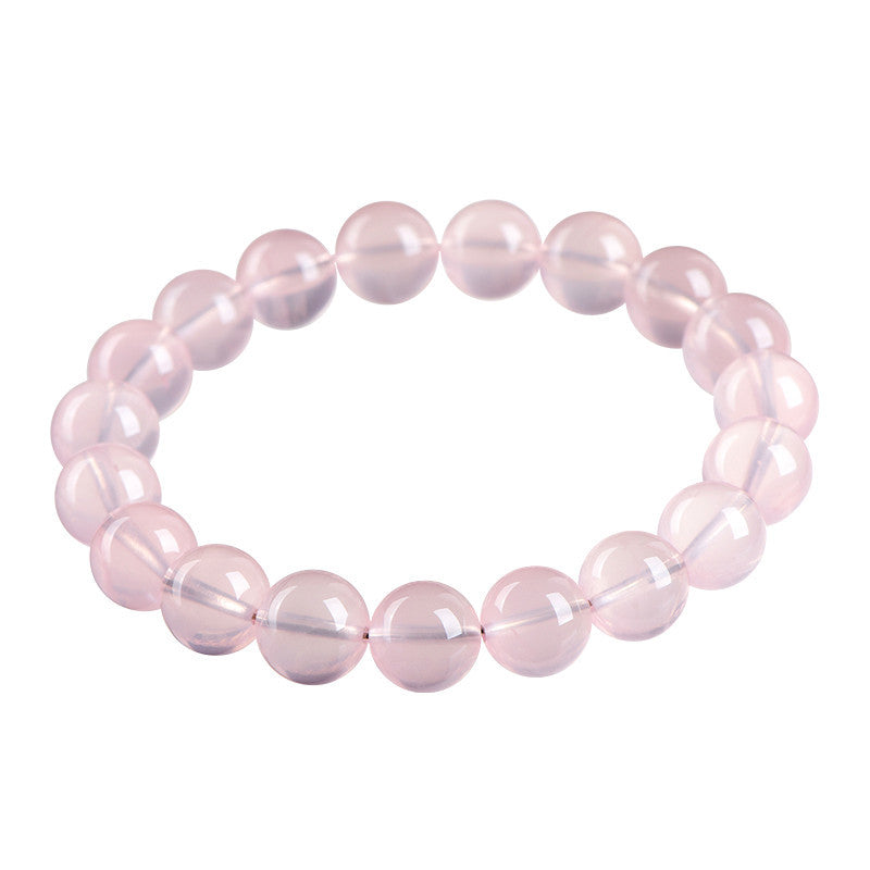 Pink quartz crystal beaded bracelet for love attraction, featuring rose quartz beads for emotional connection and romance.