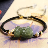 Green jade Pixiu wealth attraction bracelet with black string and pearl for men, symbolic energy flow