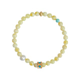 Green turquoise beaded bracelet for attracting luck and good fortune, featuring natural gemstone beads and a feminine design.