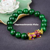 Green Jade Stone and Dark Jade beaded bracelet for wealth manifestation, with a gold-plated Pixiu charm.