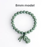 Women's jade bracelet with Pixiu for wealth flow, made of green jadeite beads and a carved charm