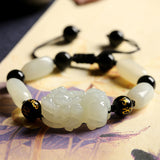 Jade beaded bracelet with Pixiu charm, a symbolic accessory for wealth manifestation and positive energy.