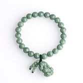 Jadeite Pixiu bracelet for wealth attraction, featuring a green jade bead design with a Pixiu charm for money flow.