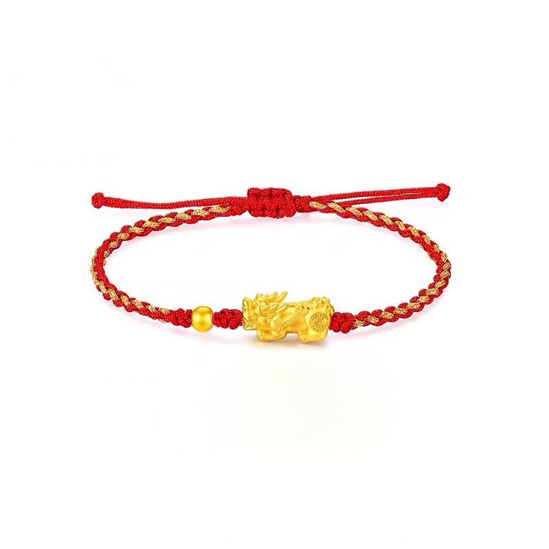 Gold Pixiu charm on a red string bracelet for wealth attraction, a symbolic feng shui accessory for men and women