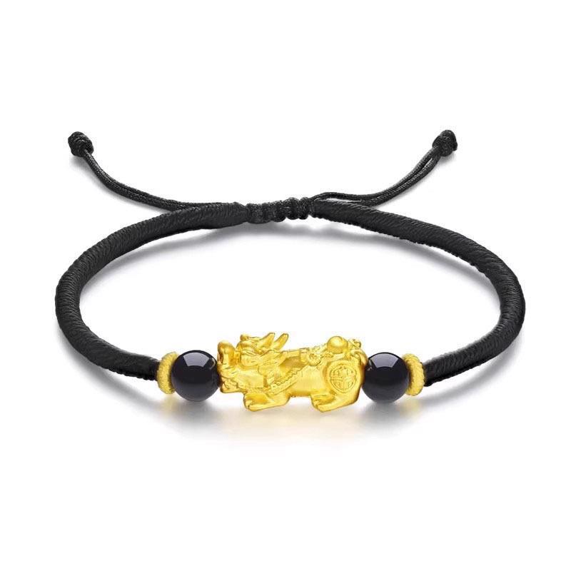 Gold Pixiu wealth attraction bracelet with black cord for men and women, featuring a gold plated charm for prosperity