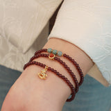 Garnet Crystal Beaded Bracelet for Attracting Love, Adorned with a Green Jadeite Pouch Charm, Women's Spiritual Jewelry