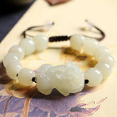 Nephrite jade Pixiu bracelet for wealth attraction, featuring a carved Pixiu charm and beaded jade stones for men's spiritual jewelry