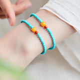 4mm turquoise crystal bead bracelet for attracting good fortune, a delicate single-strand design with symbolic accent beads.