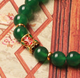 Green agate crystal bracelet for women, a beaded stone jewelry piece for wealth attraction and money energy.