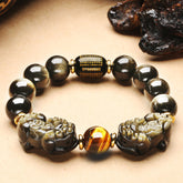 Black Obsidian Pixiu bracelet for wealth attraction, featuring a carved Pixiu charm and beaded design for men and women