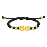 Gold plated Pixiu wealth bracelet with black string for men, a feng shui accessory for money attraction and energy flow.