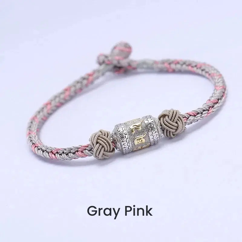 Grey string bracelet with silver mantra charm for luck attraction, spiritual energy flow accessory