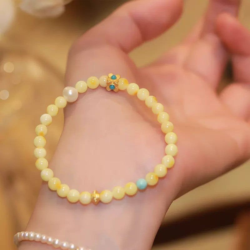 Feminine turquoise beaded bracelet with decorative pearls, a crystal bracelet for luck and clearing energy obstacles.