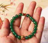 Beaded green agate bracelet, a women's accessory symbolizing wealth attraction and positive money flow.