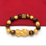Gold plated Pixiu charm on Tiger's Eye stone bracelet for wealth manifestation and money energy flow