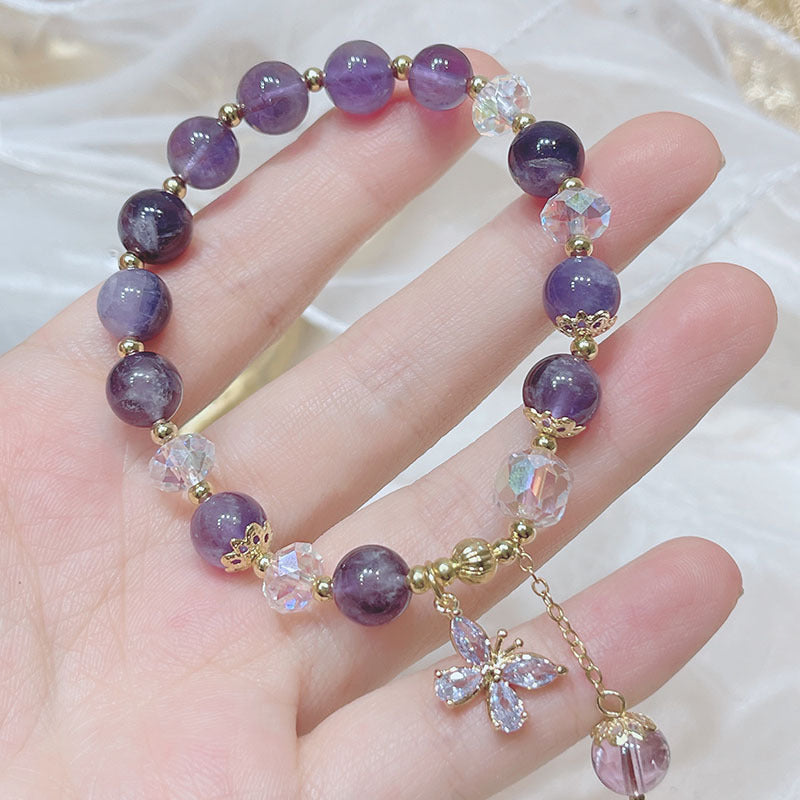 Purple amethyst beaded bracelet with butterfly charm, a crystal accessory for emotional harmony