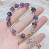 Purple amethyst beaded bracelet with butterfly charm, a crystal accessory for emotional harmony