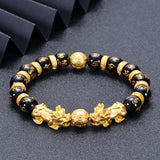 Men's beaded bracelet with gold plated Pixiu charm and black agate stones for wealth manifestation