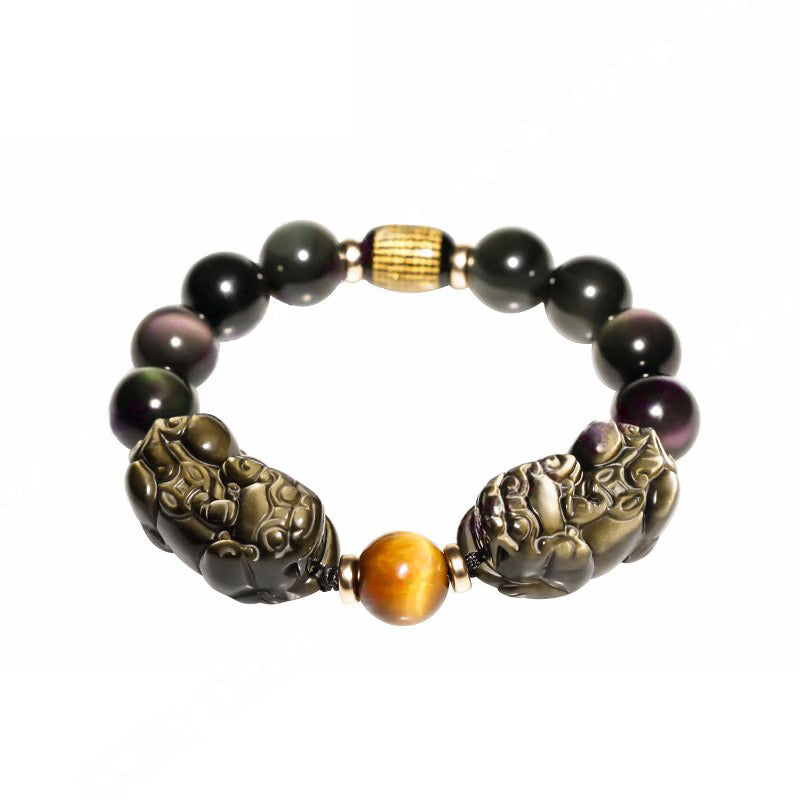 Men's black obsidian beaded bracelet with Pixiu charm, a symbolic accessory for attracting wealth and prosperity