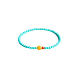 Green turquoise beaded bracelet for luck attraction, featuring 4mm beads and a symbolic charm for positive energy flow.