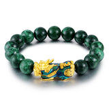 Green jade stone beaded bracelet with Pixiu charm for wealth attraction, featuring gold plated accents and color-changing beads.