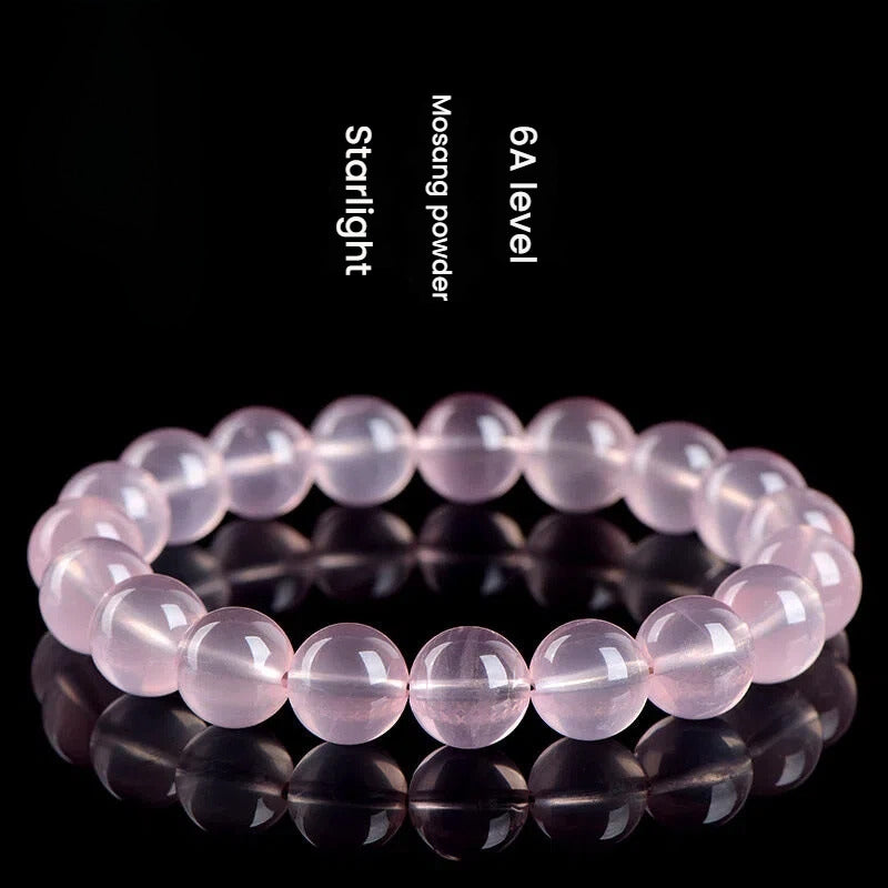 Rose quartz crystal stone bracelet for love manifestation, with pink quartz beads to attract soulmate energy.
