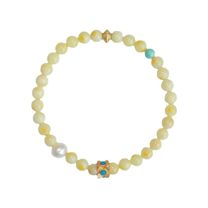 Green turquoise beaded bracelet for attracting luck and good fortune, featuring natural gemstone beads and a feminine design.