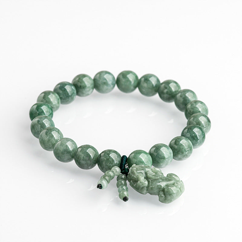 Green jade Pixiu bracelet for attracting wealth, a beaded stone accessory with symbolic meaning for women