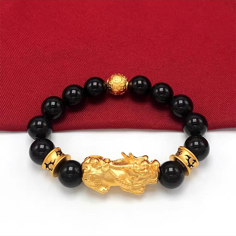 Men's wealth attraction bracelet with a gold-plated Pixiu and black beads, a stylish spiritual accessory