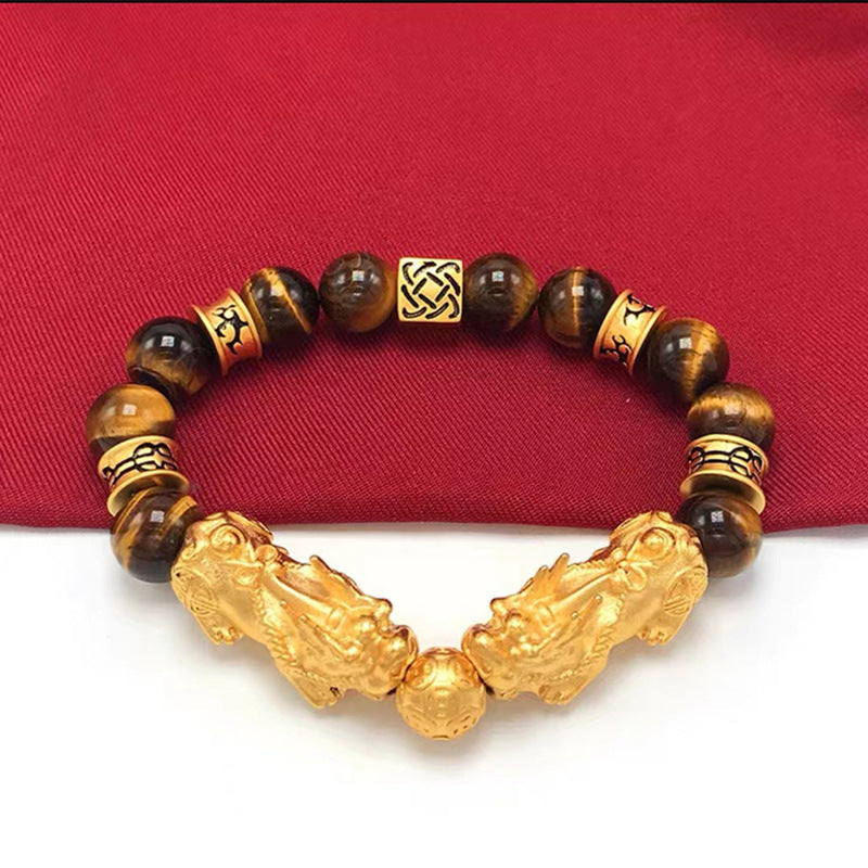 Tiger's Eye crystal bracelet with gold plated Pixiu for wealth flow and symbolic meaning