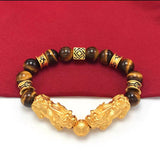 Tiger's Eye crystal bracelet with gold plated Pixiu for wealth flow and symbolic meaning