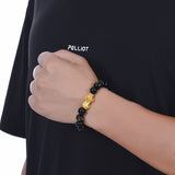 Black agate stone bracelet with gold Pixiu for men, symbolizing wealth attraction and financial stability.