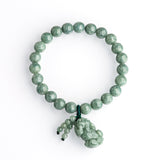 Jadeite Pixiu bracelet for wealth attraction, featuring a green jade stone charm and beaded design for women