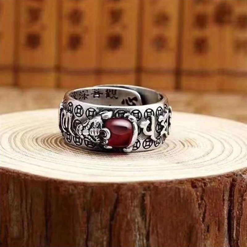Men's silver ring with red garnet bead and Pixiu symbol for attracting wealth energy