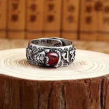Men's silver ring with red garnet bead and Pixiu symbol for attracting wealth energy