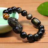 Black Obsidian stone bracelet with Pixiu symbol, a spiritual accessory for attracting wealth and prosperity.