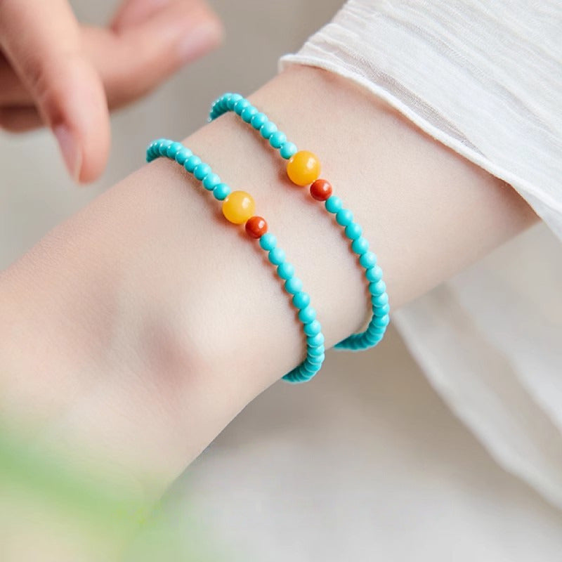 4mm turquoise crystal bead bracelet for attracting good fortune, a delicate single-strand design with symbolic accent beads.