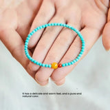 Women's turquoise beaded bracelet for luck, combining green turquoise with red agate and amber beads in a fine 4mm strand.