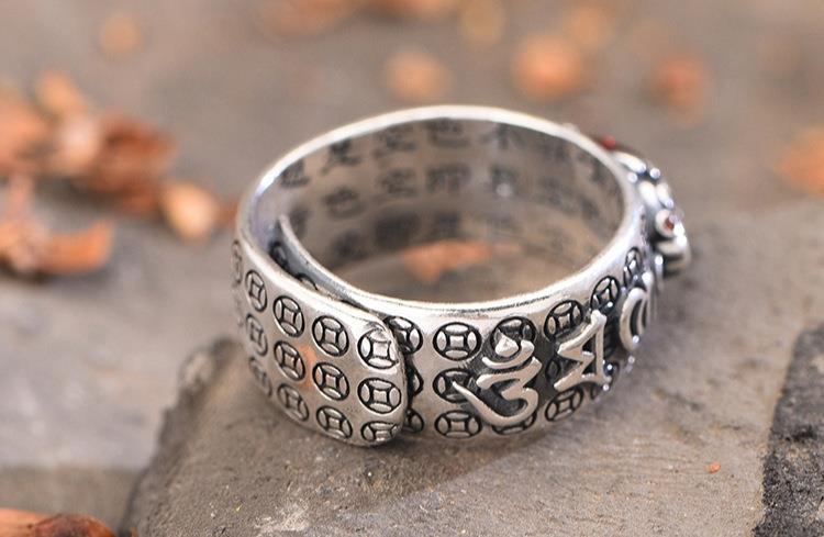 Silver wealth ring with Pixiu symbol and deep red garnet stone, unisex design
