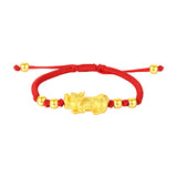 Gold plated Pixiu charm on a red string bracelet for wealth attraction and money flow, a symbolic men's beaded bracelet