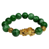 Green jade beaded bracelet with Pixiu charm and gold plated accents for wealth attraction and energy flow