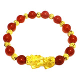 Wealth attraction bracelet with red agate beads and a detailed Pixiu charm in gold plated finish.