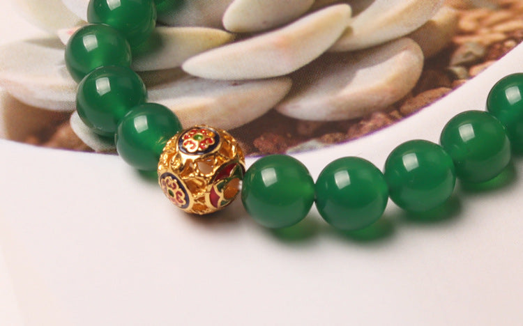 Green agate wealth bracelet for women, featuring smooth stone beads for financial energy and abundance.