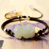 Black Obsidian and Hetian Jade Pixiu bracelet for men, a wealth attraction talisman with gold plated accents