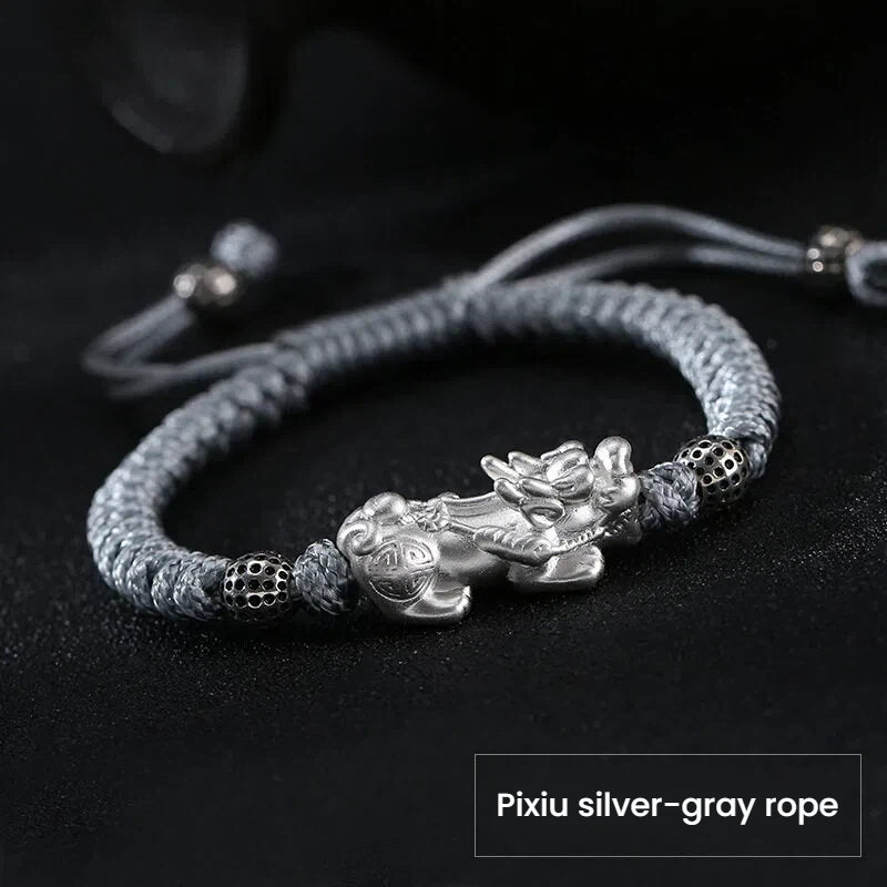 Silver Pixiu bracelet for wealth attraction, featuring a mythical creature charm on a silver-gray cord for men and women.