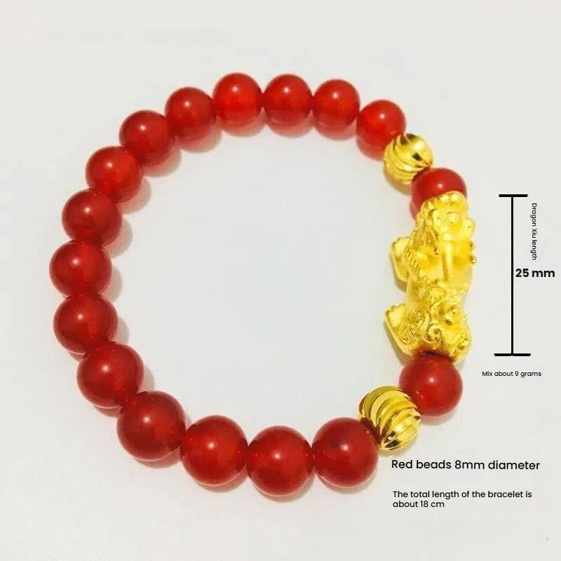 Gold plated Pixiu charm on a red agate stone bracelet, a symbolic accessory for wealth manifestation and energy flow.