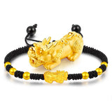 Gold Pixiu charm on black beaded string bracelet for wealth manifestation and prosperity