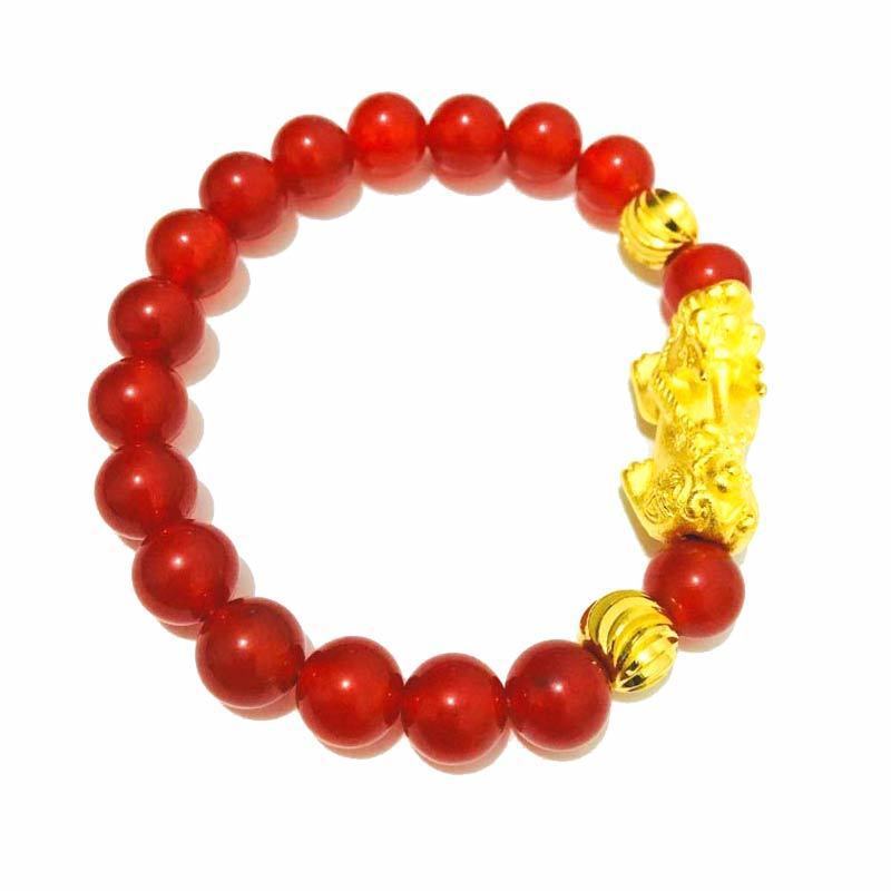 Red agate beaded bracelet with Pixiu charm for wealth attraction, featuring gold plated accents and natural stone beads.